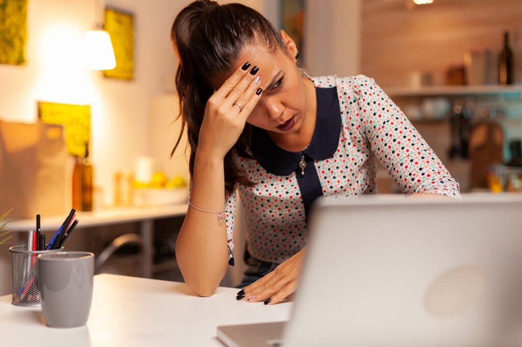 Frustrated user looking at slow computer